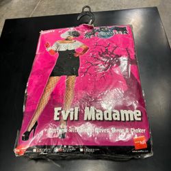 Sexy Cruella DeVille costume still in the bag …size medium.. comes with wig , top , skirt, gloves 