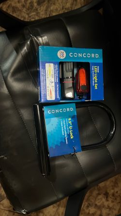 Brand new bike lock with key and bike, light front and back