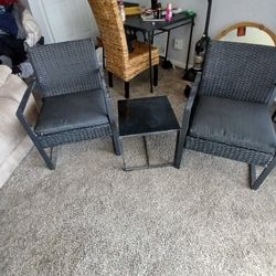 2 Black Weeved Chairs Woth Matching Table