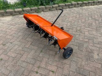 Tow behind aerater