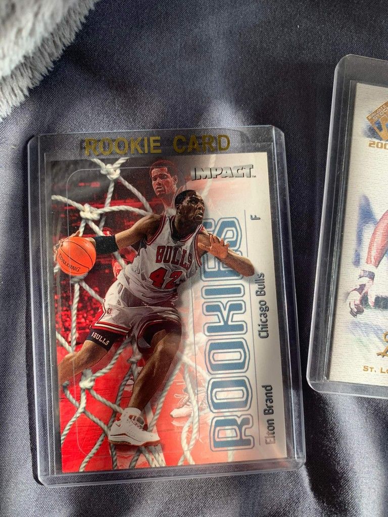 Baseball football and basketball cards