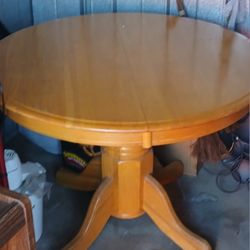 HomeStock Oak 48" Round To 66" Oval Extendable Butterfly Leaf Pedestal Dining Table , Light Oak 