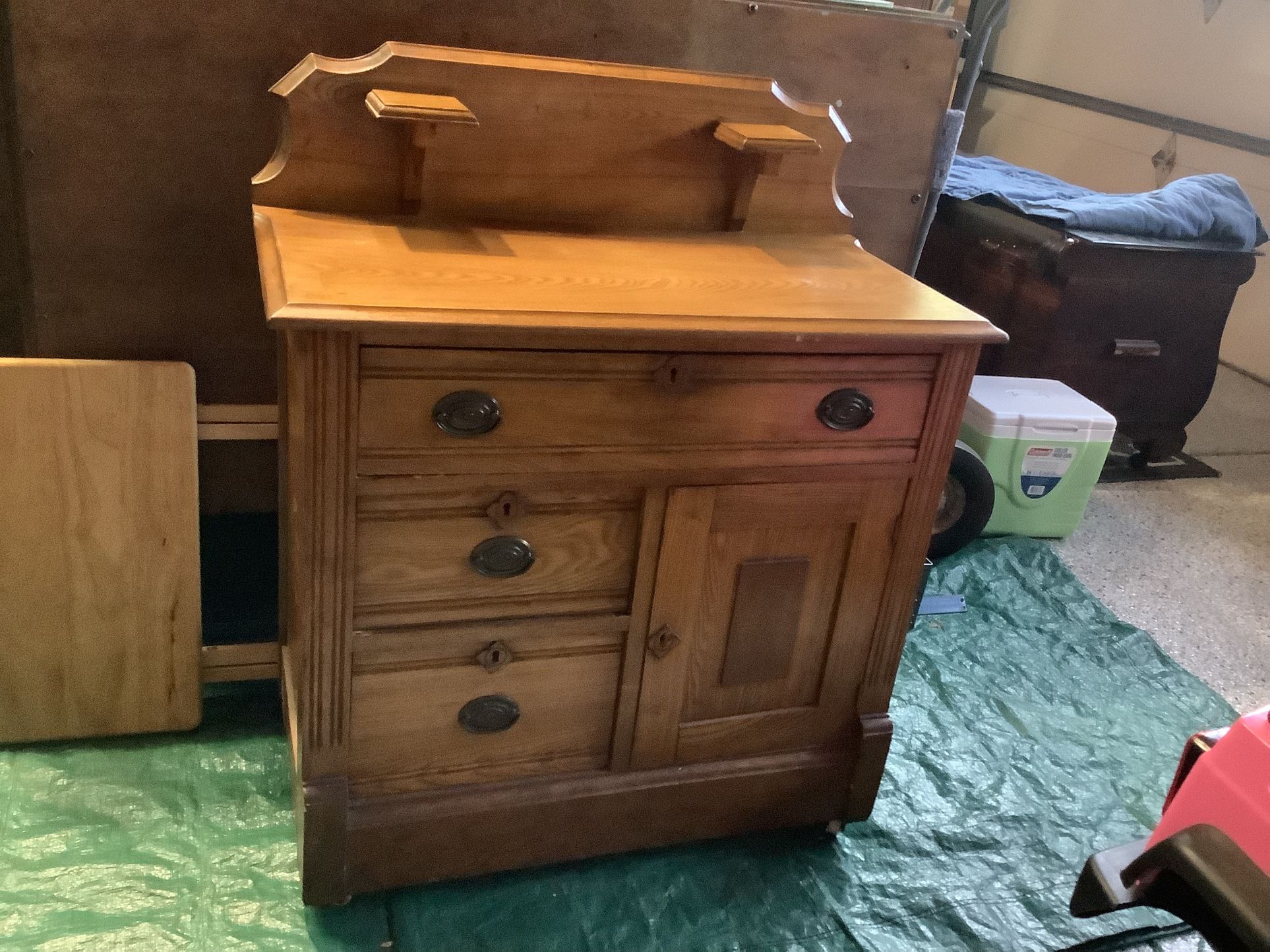 Antique oak wooden wash sink 1920s on wheels all drawers work Candle holder shelves approximately 30” wide Approximately 28” tall 3 drawers and one ca