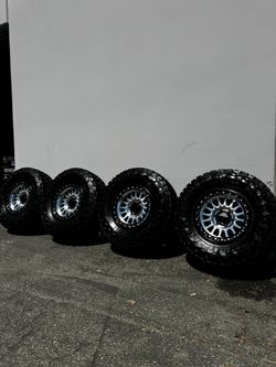 FINANCING AVAILABLE KMC KM552 IMS 6x135 17" Wheels With 35” Toyo R/T Pro Tires Machined with Black Lips