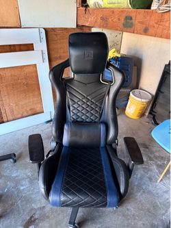 RS Gaming chair with desk and two monitors