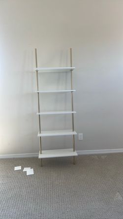 gold and white ladder shelf