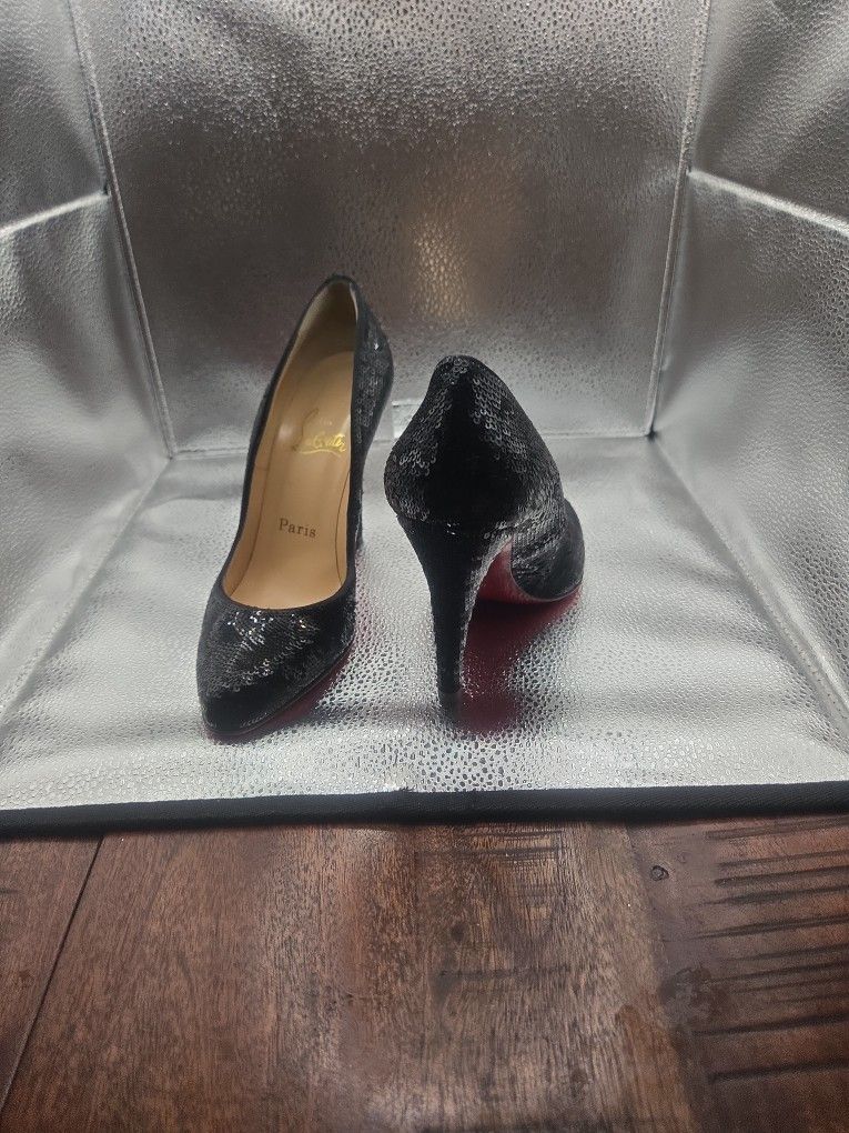 Christian Louboutin Black Heels With Red Bottoms