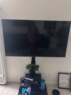Large Samsung Flat Screen TV on Floor Stand