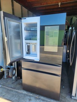 Samsung 4-door refrigerator, 36" wide x 68.5" high x 29" deep, in good condition