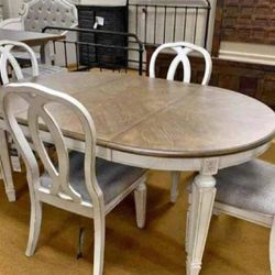 Realyn Chipped White Dining Room set Table And Chairs 