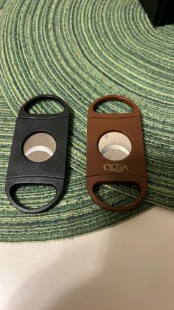 2 nice plastic and metal cigar cutters