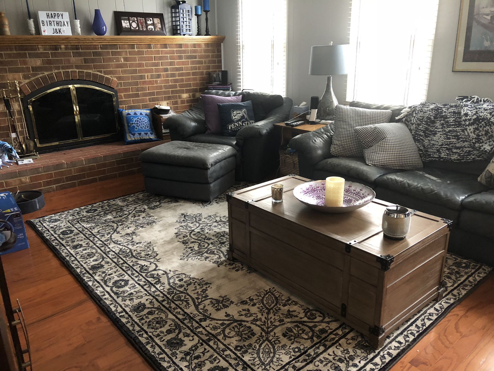 Leather couch, two chairs, two ottomans