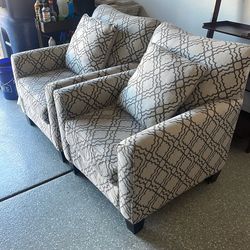 Two Comfy Fabric Chairs With Pillows