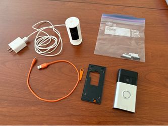 Two Ring video Cameras: Battery Doorbell Head-to-Toe HD Video with 2-Way Talk, and an indoor camera Like New