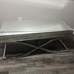 Coffee table with glass top.