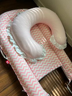 Baby Nursing Pillow + Infant Lounger Set – Pink – Excellent Condition  Price: 20$  Description: Gently used baby nursing pillow and infant lounger in 