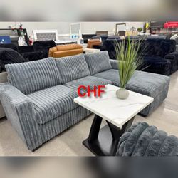 Light gray corduroy sectional couch with chaise
