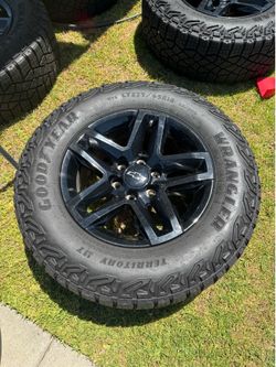 Trailboss Gloss Black Set Of Four Chevy Silverado Wheels 275/65R18 GoodYear Wrangler Territory MT 6 on 139.7 6 on 5.5 Lug Pattern!