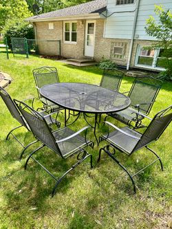 Wrought iron table with 6 Bouncy chairs and 2 seat glider, Delivery Available for extra cost