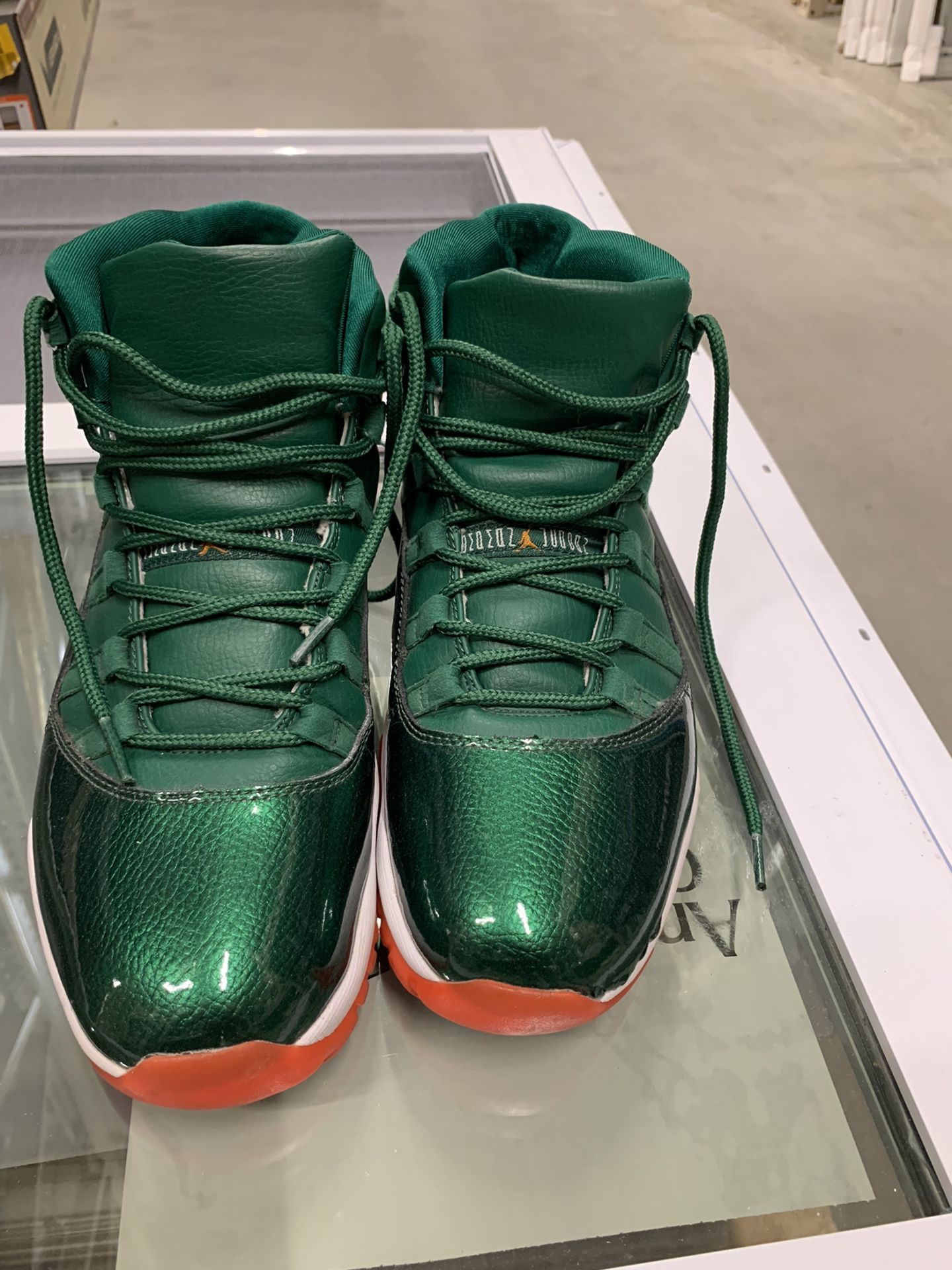 Jordan 11 miami hurricanes price best sale