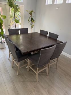 $400 Adjustable Counter Height dining table with 8 chairs