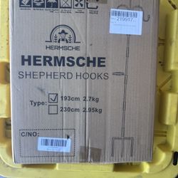 HERMSCHE brand shepherd hook set. It is designed for hanging bird feeders, plant baskets, or solar lights in a garden.  The hooks are typically made o