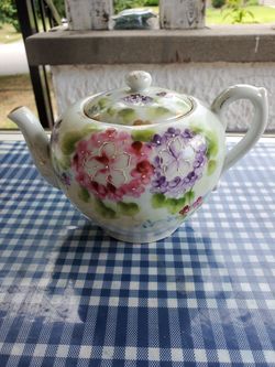 Cute little 5 inch floral pattern teapot.