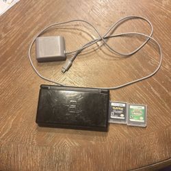 DS Lite with charger along with Pokemon Black and Pokemon Explorers Of Sky