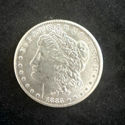 1885 CC Morgan Silver Dollar. Looks ALMOST UNC. Nice Coin For A Collection.