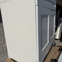 30” NO TOP VANITY CABINET WITH DAMAGE ON THE BOTTOM LEFT SIDE 