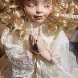 Porcelain praying angel doll