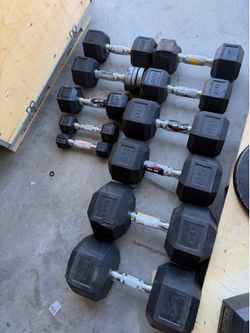 11 rubber dumbbells in TOTAL. SOLD AS IS 1-3-5-15lb and pair of 20,25 and 1-40,45,60,65lb