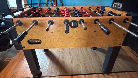 Foosball Table with Red and Blue Players