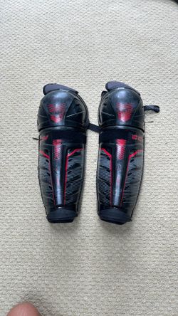 Men’s ice hockey large shin guards.