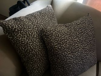 2 cheetah print pillows
