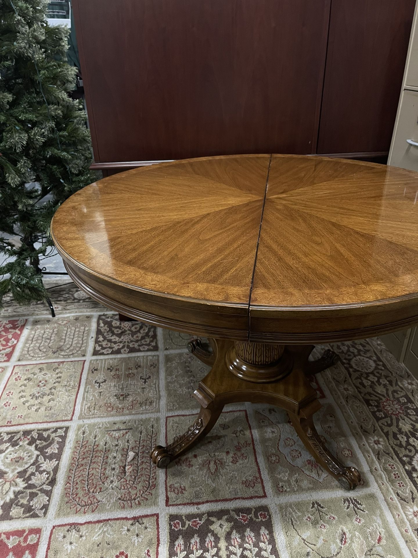 Wooden Round Table with Unique Bottom Details