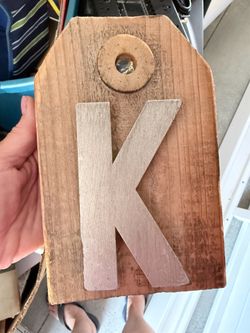 rustic wooden sign "K"