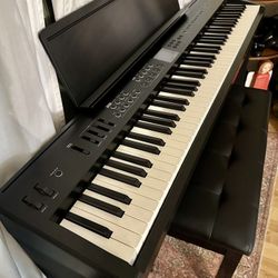Roland FP-E50 88 key digital piano with stand, pedals, and bench