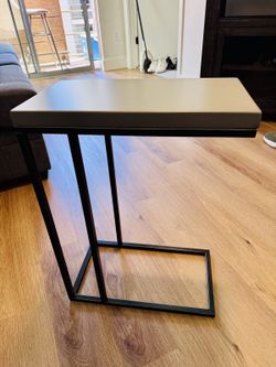 Living Spaces C-shaped sofa side table, grey top, black metal frame