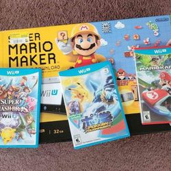 Wii U in box with games