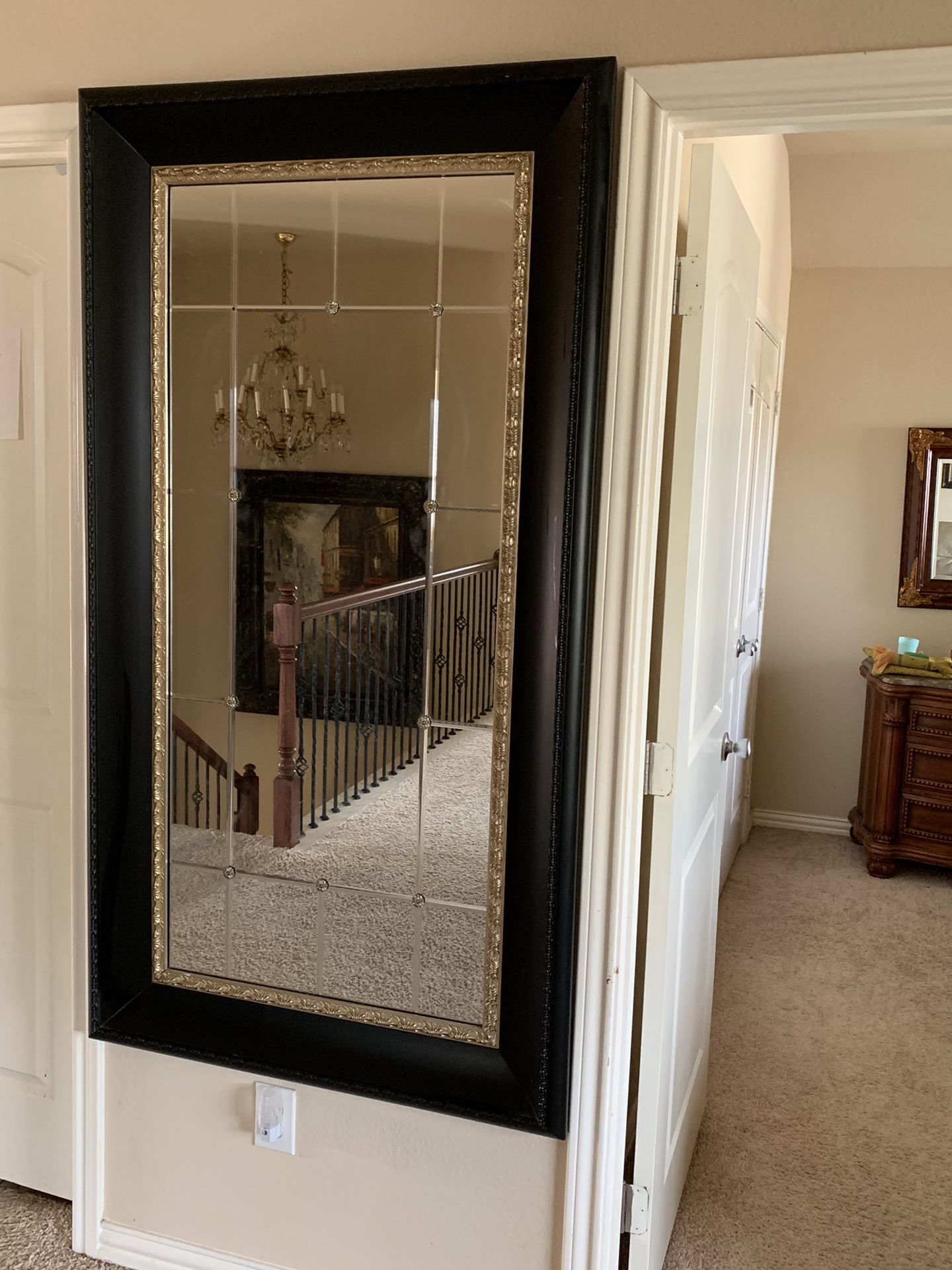 Framed mirror with metal flower inserts