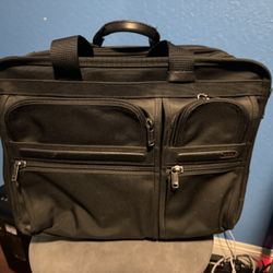 Tumi - laptop bag/roller