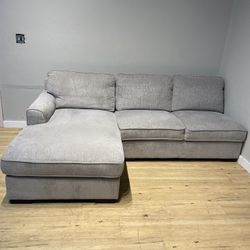 Gray sectional sofa couch with missing piece