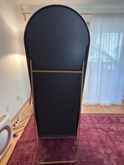 Large brass arched mirror