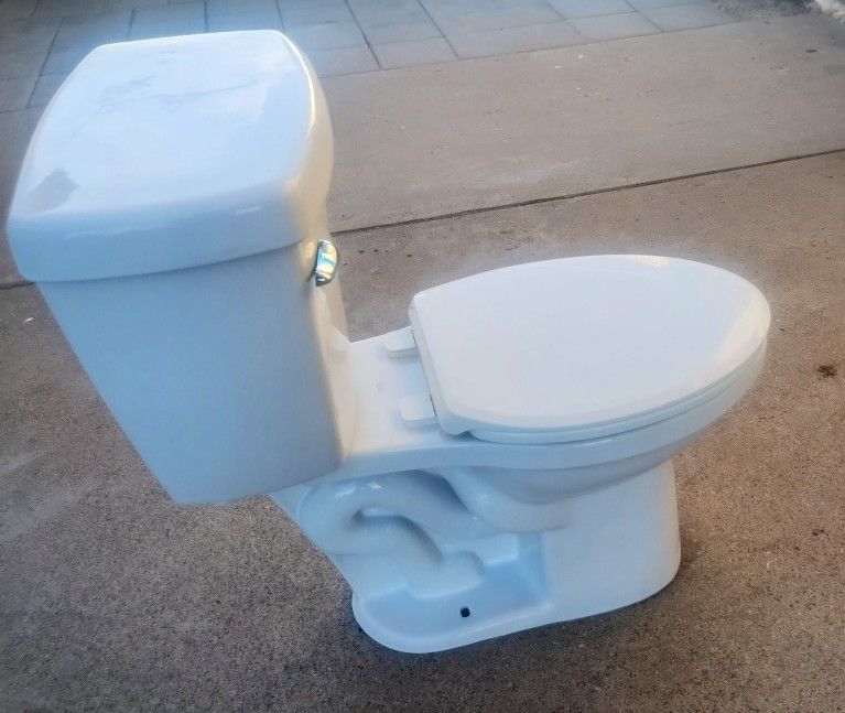 2 Delta Toilets Like New
