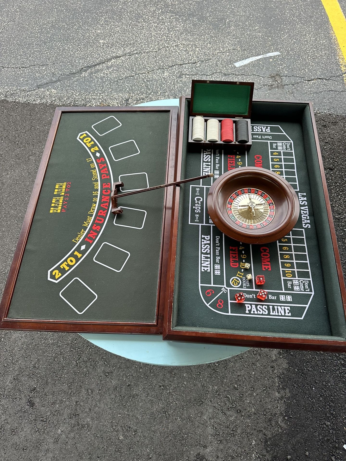 3-in-1 casino game table, which includes surfaces for Blackjack, Craps, and Roulette