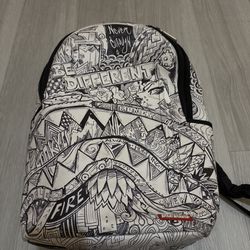 It's a Sprayground Book bag Color Is White And Black 