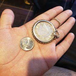 The Coin By It Self is 1 Ounces Of .999 pure silver. Plus 1 Ounce on 28 inch Chain rope silver 925 with bazel. I didn’t ask about weight prices $240 f