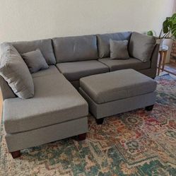New! Gray Fabric Reversible Sectional and Ottoman