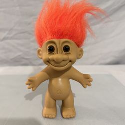 Vintage Russ troll doll with orange hair and original sticker